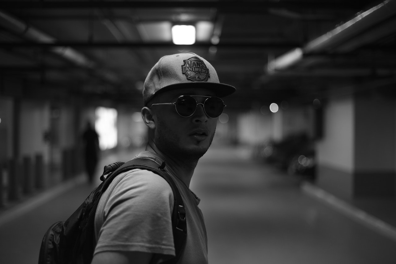 a balck and white shot of a male traveler